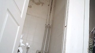Chunky white brunette lady texting and pissing in the toilet