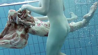 Two hot hairy babes underwater