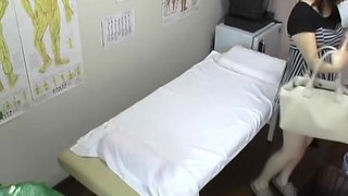 Japanese babe gets fingered during erotic massage session