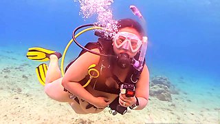 Naked duo has some fun scuba diving together