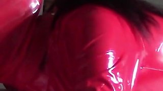 MILF in Red Latex Suit and Patent Leather High Heels Gives a Blowjob with Swallow