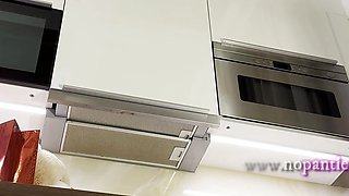 Hot sexy redhead college girl with her long legs and cotton panties in the kitchen gets bored and ignored