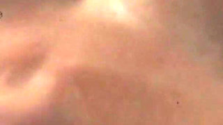 Stepmom on her bed with her dildo