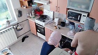Amateur couple having fun in the kitchen