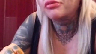 Blonde tattooed milf eats spaghetti on the toilet