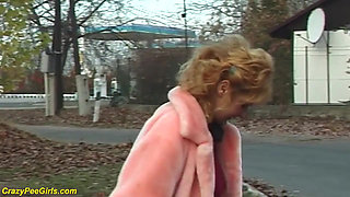 Redhead wife pissing in outdoor