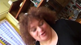 Italian bbw enjoys a big dildo in her fat and hairy pussy