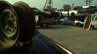 Hot sexual moment in a car demolition...