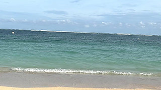 Teasing on the Beach in Micro Bikini on the Sand