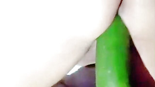 Big ass girl with tight pussy tries to fit a huge cucumber in her tight pussy