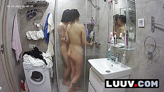 LUUV. Tattooed Alice joins her boyfriend in the shower. The webcam is on