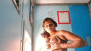 Tina Nandy and Tejaswini Prabhakar whispering in the dark