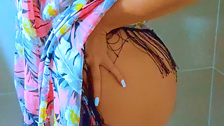 Watch this stunning Brazilian beauty shower in a black string thong