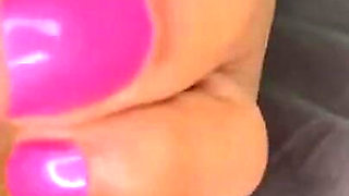 Ebony Girl Gives Her Feet a Massage with a Massage Gun