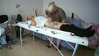 Mother-in-law sucks and jerks off my dick on the massage table and swallows cum