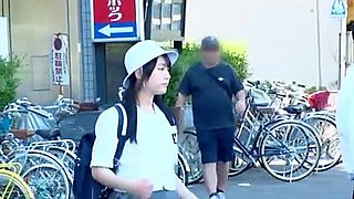 A man targets a girl in a uniform, groping her body and lifting her skirt to touch her buttocks.