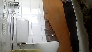 Redhead young white girl pisses in the toilet room and gets recorded on hidden cam