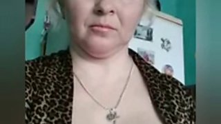 Russian woman strips naked in front of the camera and masturbates