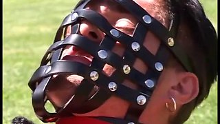 Leather mistress fuck her slave outdoor