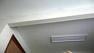 Blonde mature with big boobs masturbates in bed