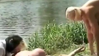 A blond girl washes herself by the river and two old men see her and want to fuck her