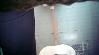Pale skin blondie wipes her pussy after pissing in the toilet