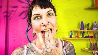 Tattooed model Illuz tests out her toys