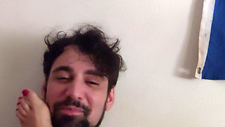 jerking off with my feet in his face