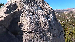 Outdoor Erotica, a Girl with a Stunning Figure Shows Her Magnificent Ass Against the Backdrop of the Sea and Mountains.
