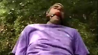 Man dominated by a woman in grove