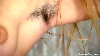 Sexy Baby Lizza strips and masturbates on a table - WeAreHairy