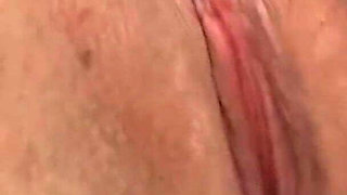 Brunette with Big Tits Gets Fingered on Bed with Rose Sheets