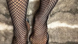 Fishnet in Open Toe Shoes with Red Nail Polish