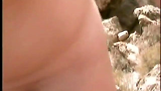 Couple filming at the beach