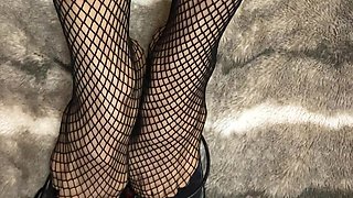 Fishnet in Open Toe Shoes with Red Nail Polish