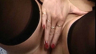 German Babe Plays with Her Pussy While Wearing Stockings