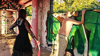 BDSM femdom flogging. Dominatrix Nika punishes her slave at sunset in an abandoned building. Back scratching.