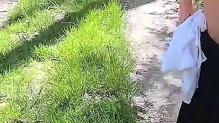 Beautiful Woman Undressing and Walking Nude with a Clit Pump Outdoors in a Public Forest