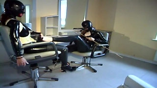 Lesbian fetish girls latex dressed in a hair salon