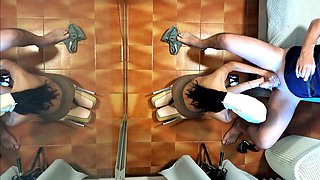 Naked milf in pantyhose and heels gives a blowjob while sipping a drink