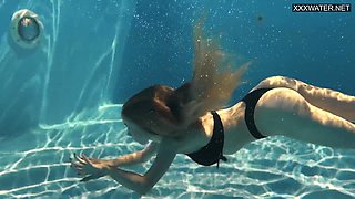 Perfect body blonde teen enjoys naked swimming