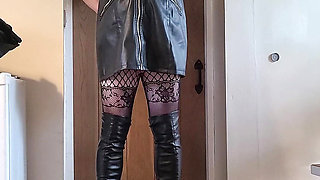 sissy in leather dress and thigh boots