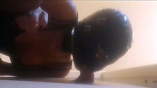High-Heeled Milf Sucks and Fucks in a Catsuit at a Gloryhole