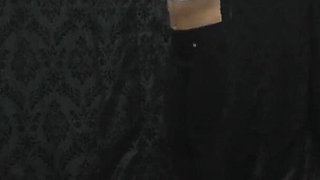 Under Nomi's Black Nike Sneakers