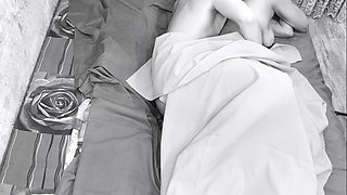 Couple caught on camera having sex in bed .