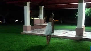 Tiny-titted Asian babe plays with herself outdoors