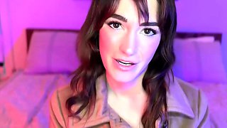 A brown haired doll with immense hooters in black