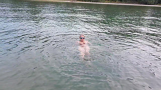 Sexy Granny Swims Naked in a Lake!