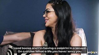 Julia De Lucia with braids and glasses gives BJ in black thong and thigh-highs on grey couch