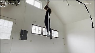 Flexible acrobat stretching to accommodate a massive toy